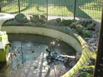 A push chair is dumped into the fountain pond (Jan 2003)